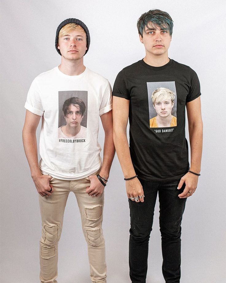 two young men standing next to each other in front of a white background wearing t - shirts with the same image on them