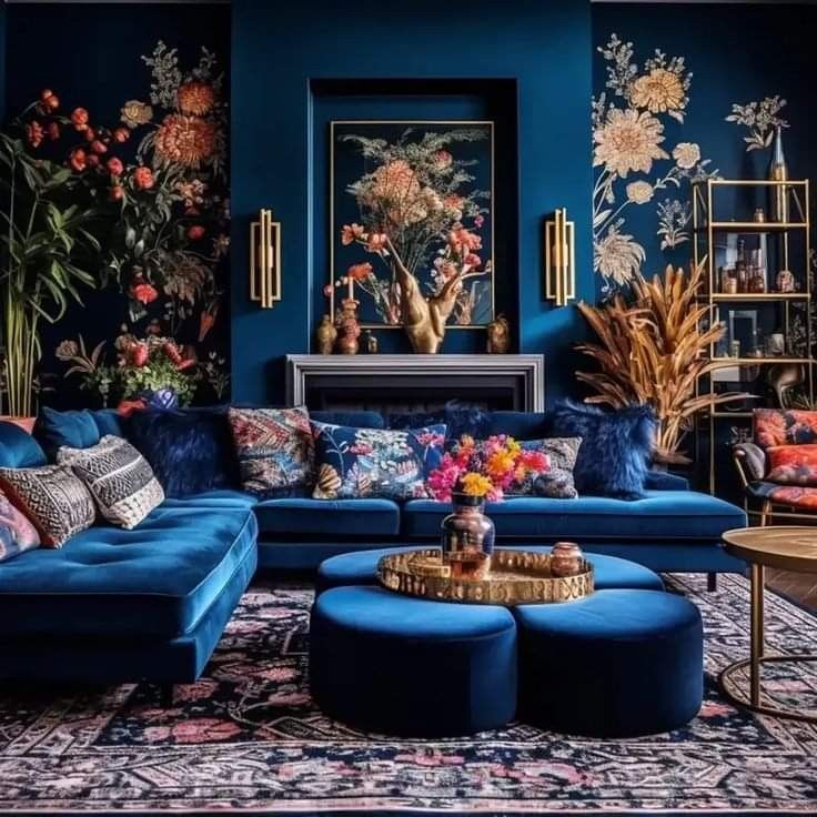 a living room filled with blue couches and pillows