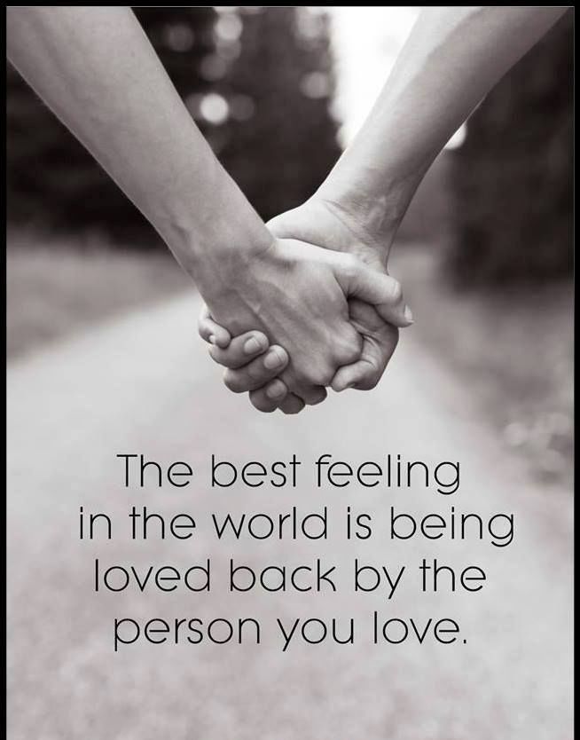 two people holding hands with the words, the best feeling in the world is being loved back by the person you love