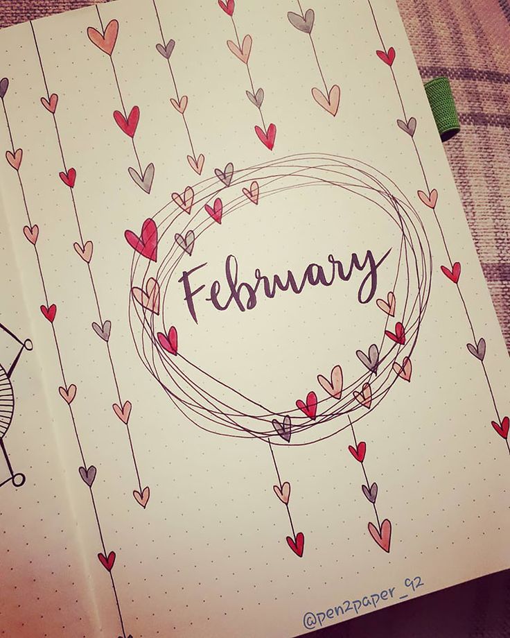 an open notebook with the word february written in cursive writing and hearts on it