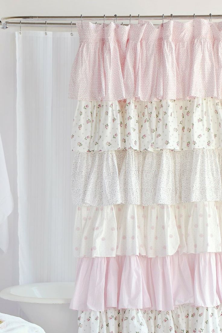 a shower curtain with pink and white ruffles