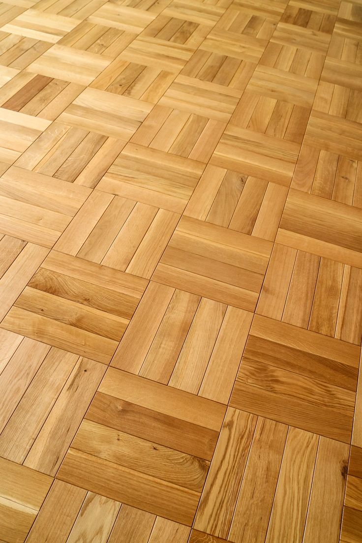 the floor is made up of wood planks and has an interesting pattern on it