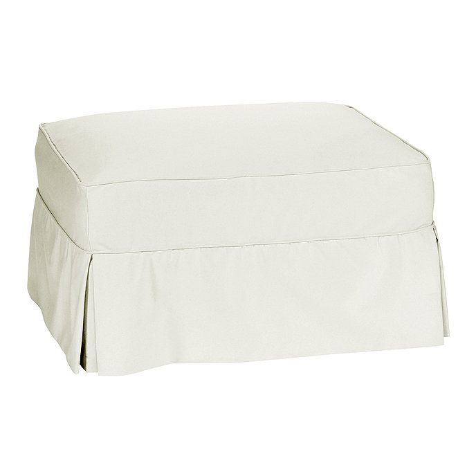 a white ottoman cover with pleated edges