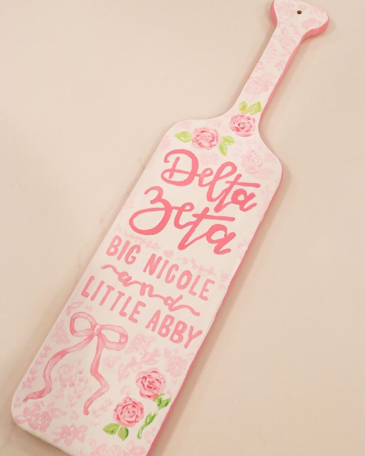 a pink bottle shaped sign that says do not give big nicole and little aby