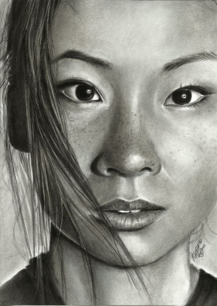 a pencil drawing of a woman's face with frecks on her hair