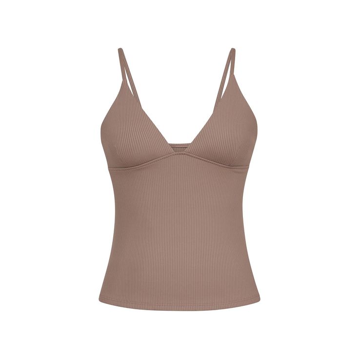 Why you’ll love: Cut from our luxurious Renew Rib, the deep v neckline toes the line of both perfect cleavage and coverage, making it the perfect barre-to-brunch crossover piece. Renew is our luxuriously ribbed performance fabric. It is made from 85% recycled Repreve nylon made from post- manufacturing waste and 15% Lycra. This fabric is knit in the US, giving it a lower carbon footprint than imported fabrics and garments.   Care: Machine wash cold with mild detergent and like colors. Hang to dry. Do not tumble dry low. Do not bleach. Do not iron. Do not dry clean. Low Cut Tank Tops, Tops Bonitos, Fit Board, Fancy Fits, Neutral Outfits, Low Cut Top, Hijabi Fashion Casual, Money And Happiness, Mens Jewelry Bracelet