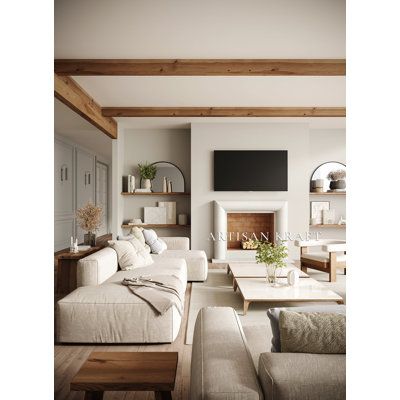 a living room filled with furniture and a flat screen tv mounted on the wall over a fireplace