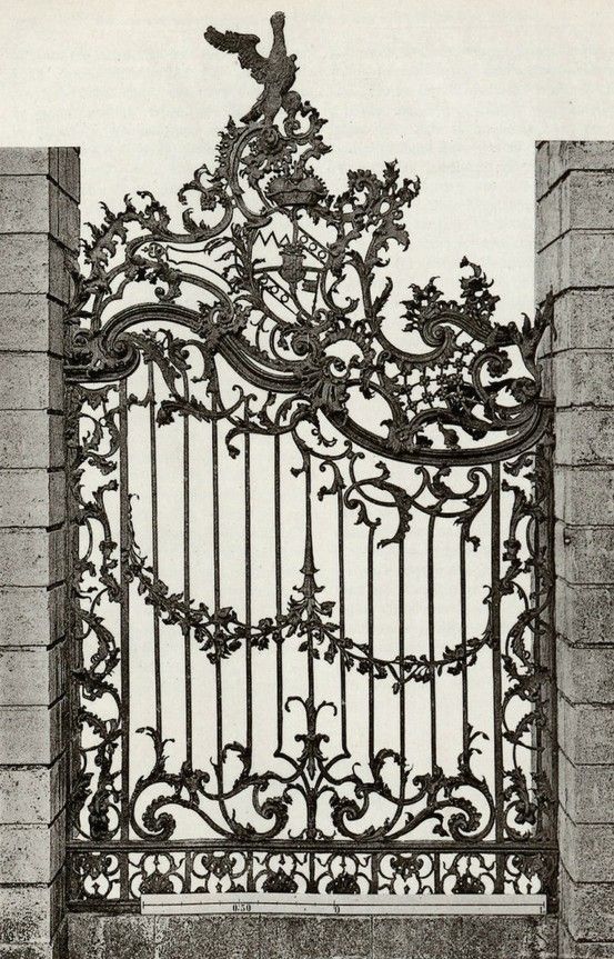 an old iron gate is shown in black and white