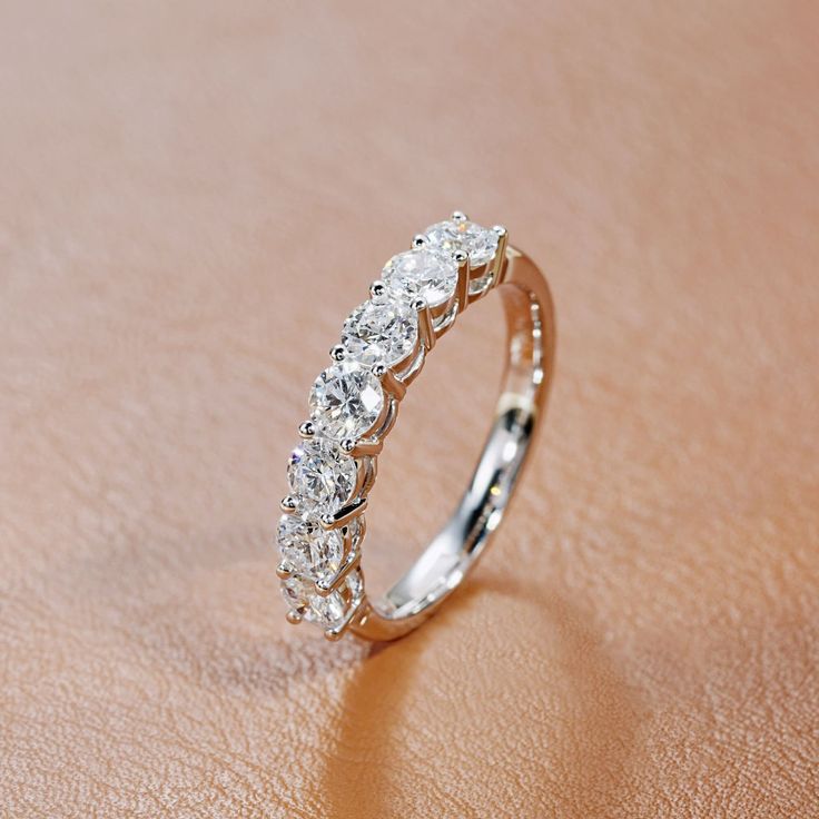 a diamond ring sitting on top of a table