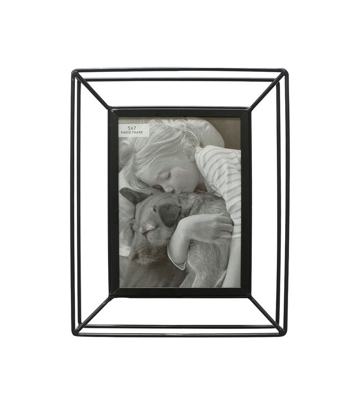 a black and white photo frame with a child holding a stuffed animal in it's lap