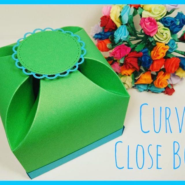 an origami box with flowers on it and the words curve close box