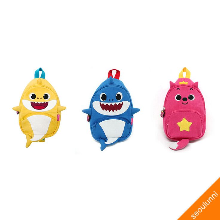 three little kids's backpacks with cartoon characters on them, one in the shape of a shark