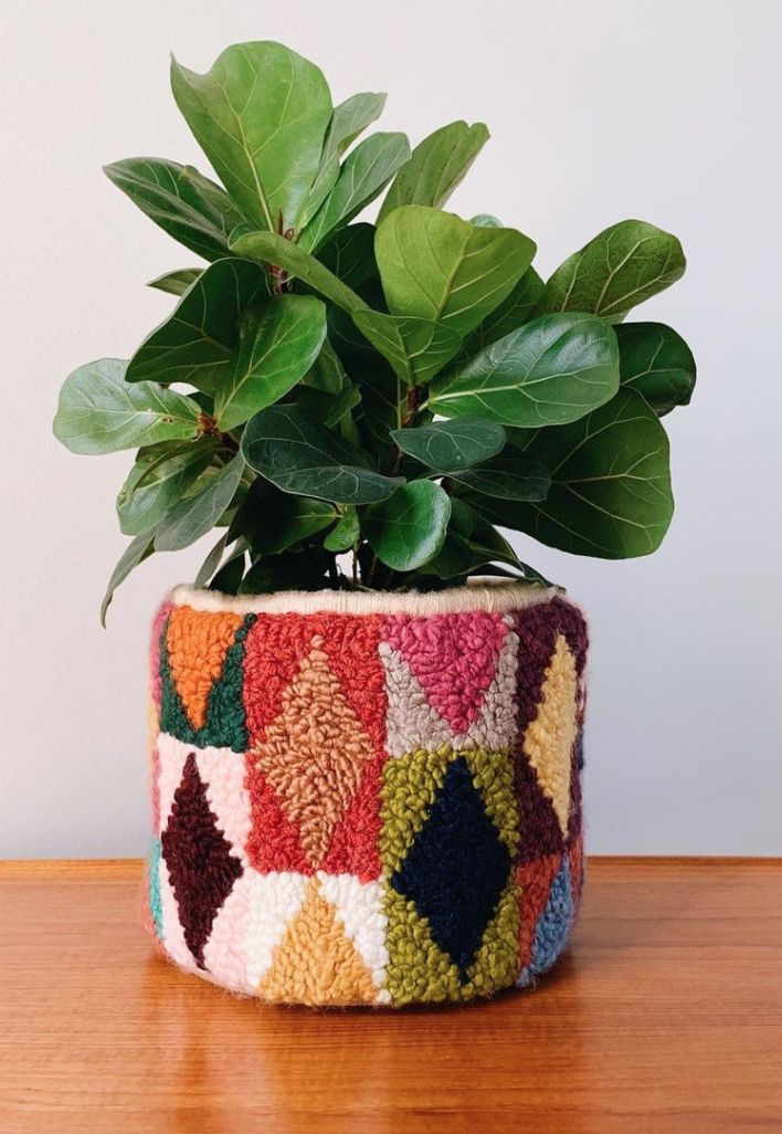 a potted plant sitting on top of a wooden table