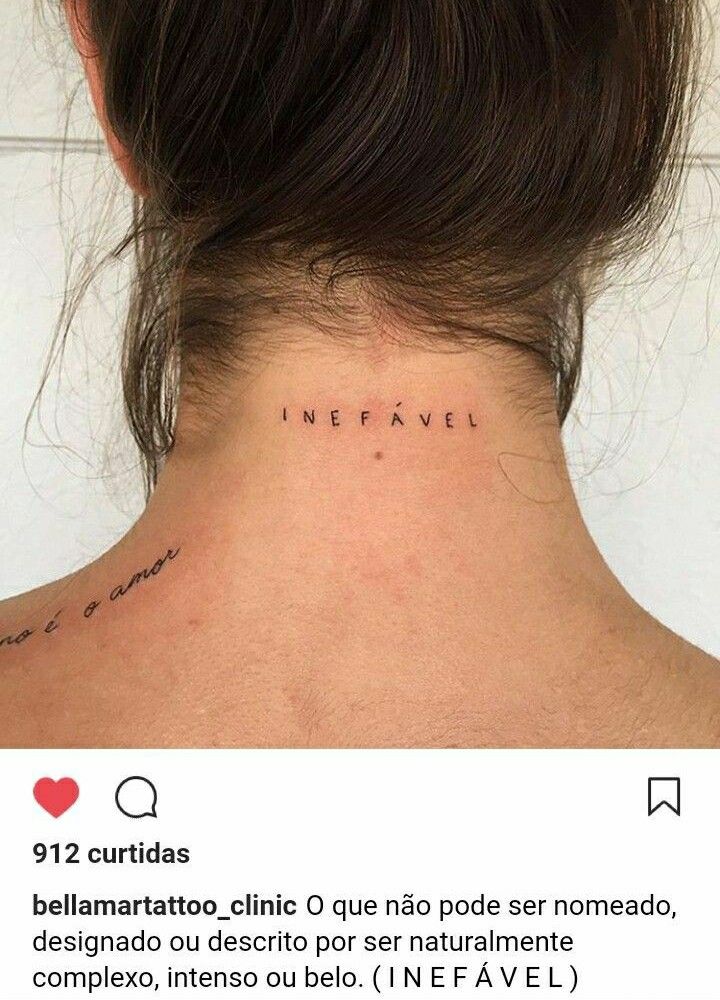 the back of a woman's neck with words written in cursive ink