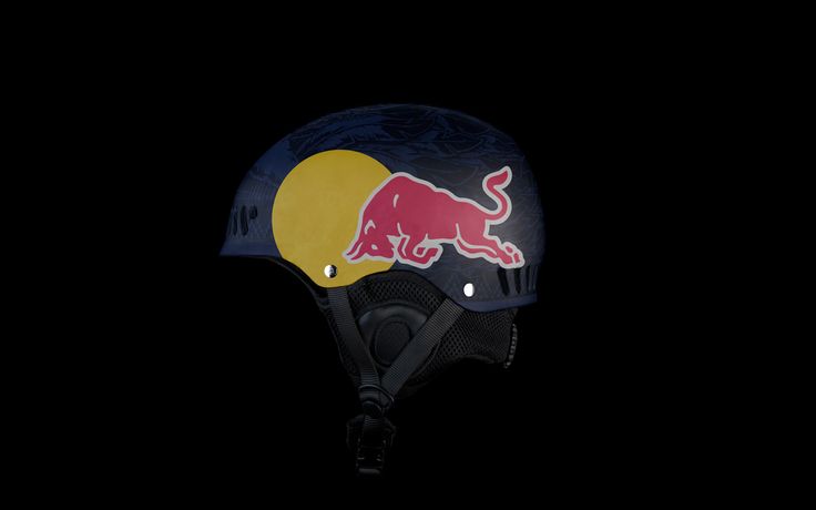 a helmet with a red bull painted on the side and yellow circle at the bottom