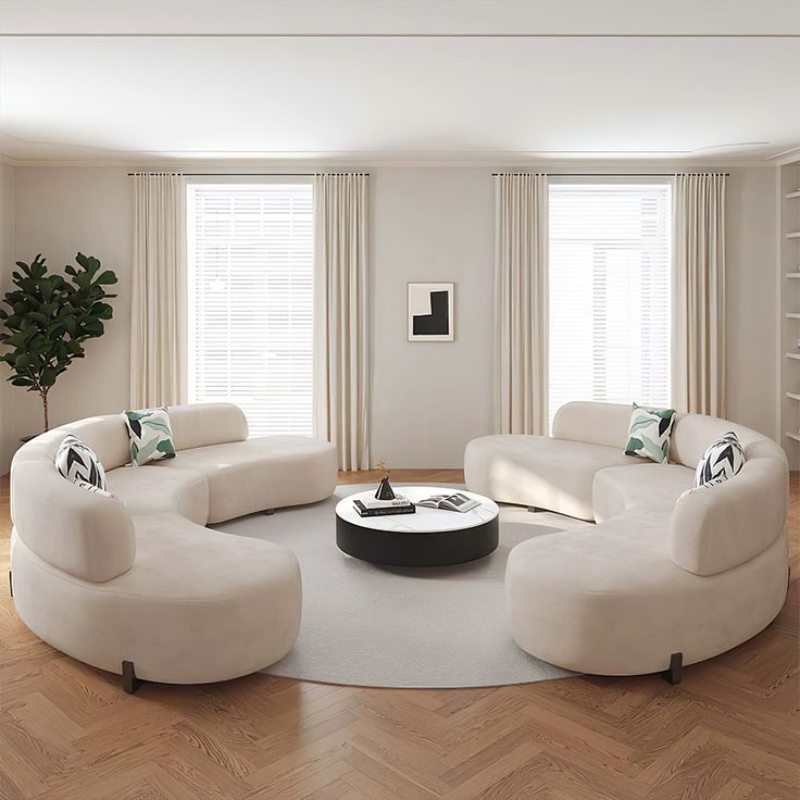 a modern living room with white furniture and wood flooring is featured in this image