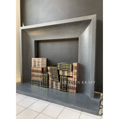 a fireplace that has some boxes in it