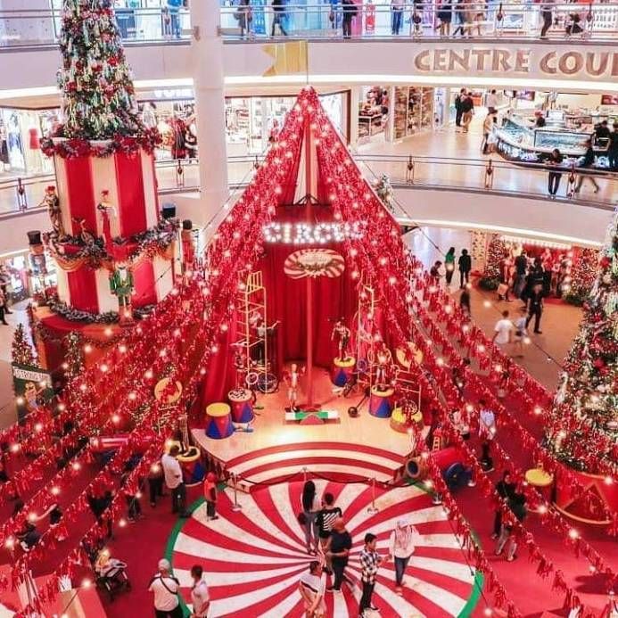 an overhead view of a shopping mall decorated for christmas