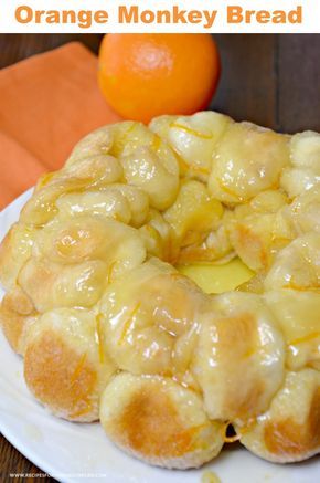 orange monkey bread on a white plate with an orange in the background and text overlay