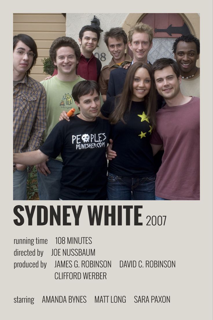 a group of young people standing next to each other in front of a white poster