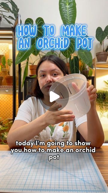 a woman sitting at a table with an object in her hand and the words how to make an orchid pot