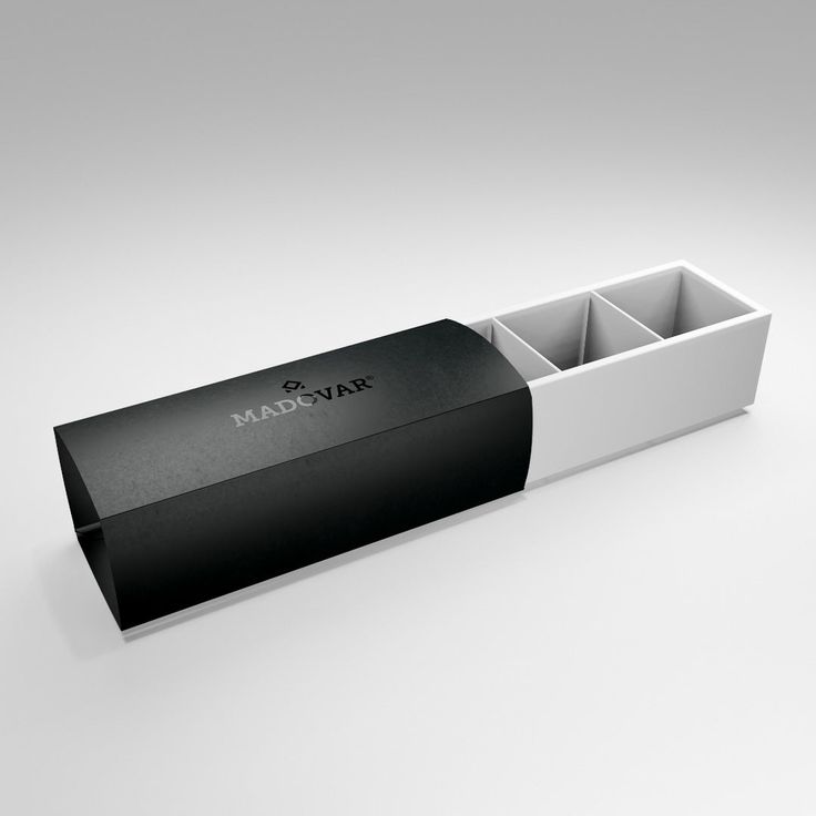 an empty black and white box with two compartments on the inside, sitting on a plain surface