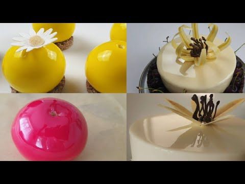 four different types of cakes with flowers on top and one is yellow, the other has pink