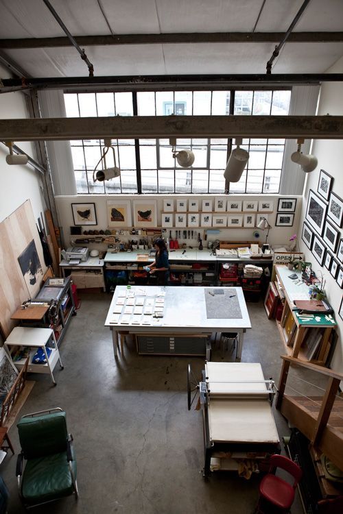 an overhead view of a room with tables, chairs and pictures on the wall in it