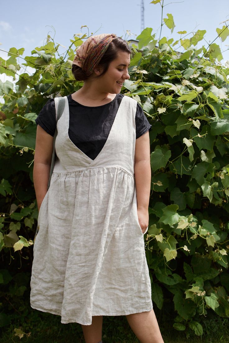 Made from 100% midweight linen.  Knee length, sleeveless dress, with a crisscrossed detail on one side of the bodice, and a scoop neck on the other, perfec to wear reversible depending on your style preference for the day.  Standard invisible pockets on either side,  Everything is customizable of course! Just choose the custom size option in the drop down menu, and leave your measurements or desired fit preferences in the personalization section when you place your order. Unlined A-line Linen Dress, Linen Knee-length Sundress For Daywear, Sleeveless Linen Pinafore Dress With Pockets, Summer Linen Pinafore Dress, Sleeveless Linen Pinafore Dress, Linen Dress Patterns, Dress Paterns, Multi Wrap Dress, Crochet Dress Boho