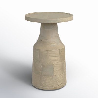 a small round table made out of concrete