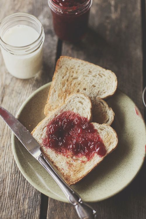 two slices of bread with jam on them