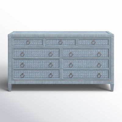 an image of a blue dresser with drawers