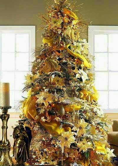 a christmas tree with gold and silver decorations