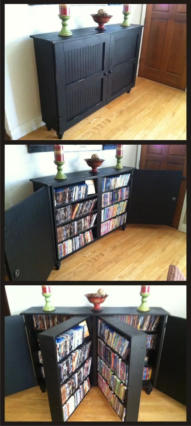 an entertainment center made out of a cabinet with several movies on the top and bottom shelves