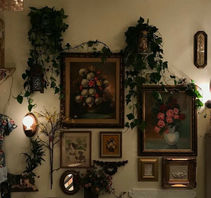 there are many pictures on the wall with flowers in vases and other things around them