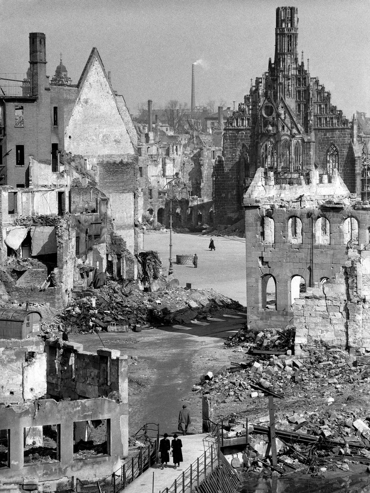 black and white photograph of destroyed buildings in an old city