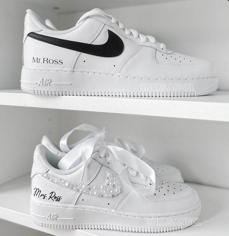 two white nike air force sneakers on shelves