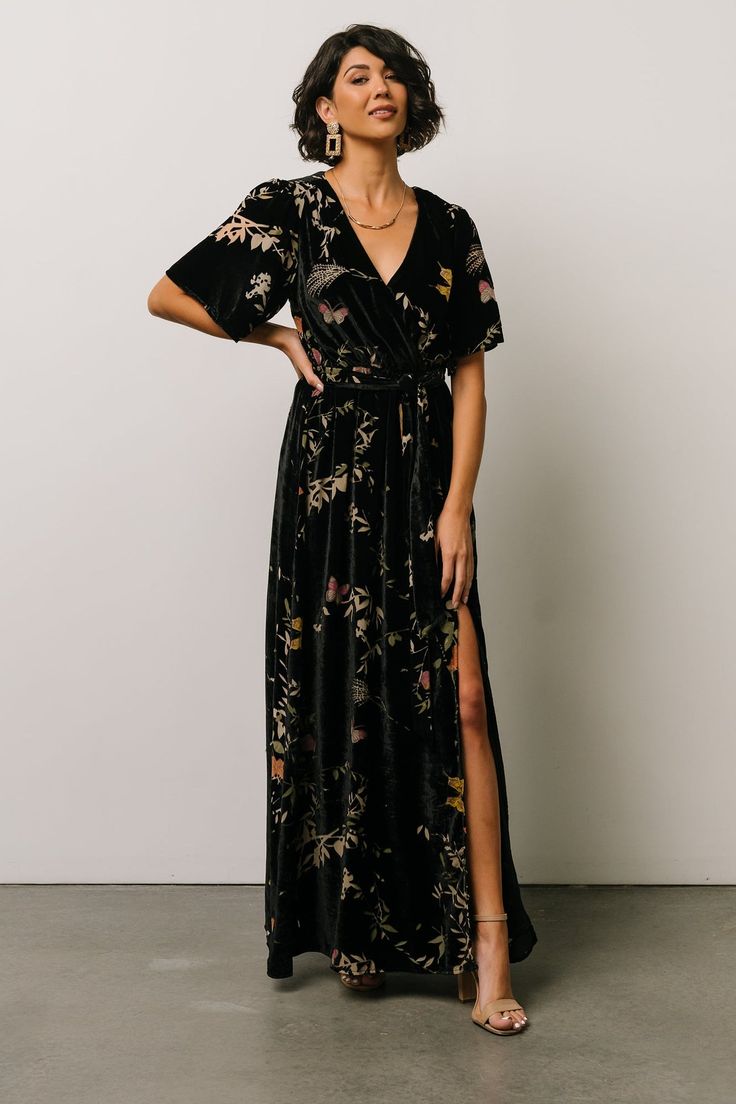 Say hello to our Uma Velvet Maxi Dress! This gorgeous dress features black velvet material with a unique burnout butterfly print. V-neck Floral Print Wrap Dress For Evening, Floral Print V-neck Evening Wrap Dress, Short Sleeve Wrap Dress With Tie Waist For Party, Short Sleeve Tie Waist Wrap Dress For Party, Party Wrap Dress With Tie Waist And Short Sleeves, Floral Print Wrap Dress For Party, Floral Print Wrap Party Dress, Short Sleeve Dresses With Tie Waist For Night Out, Embossed Velvet