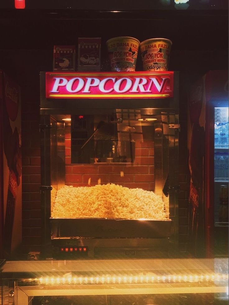 a popcorn machine sitting inside of a building