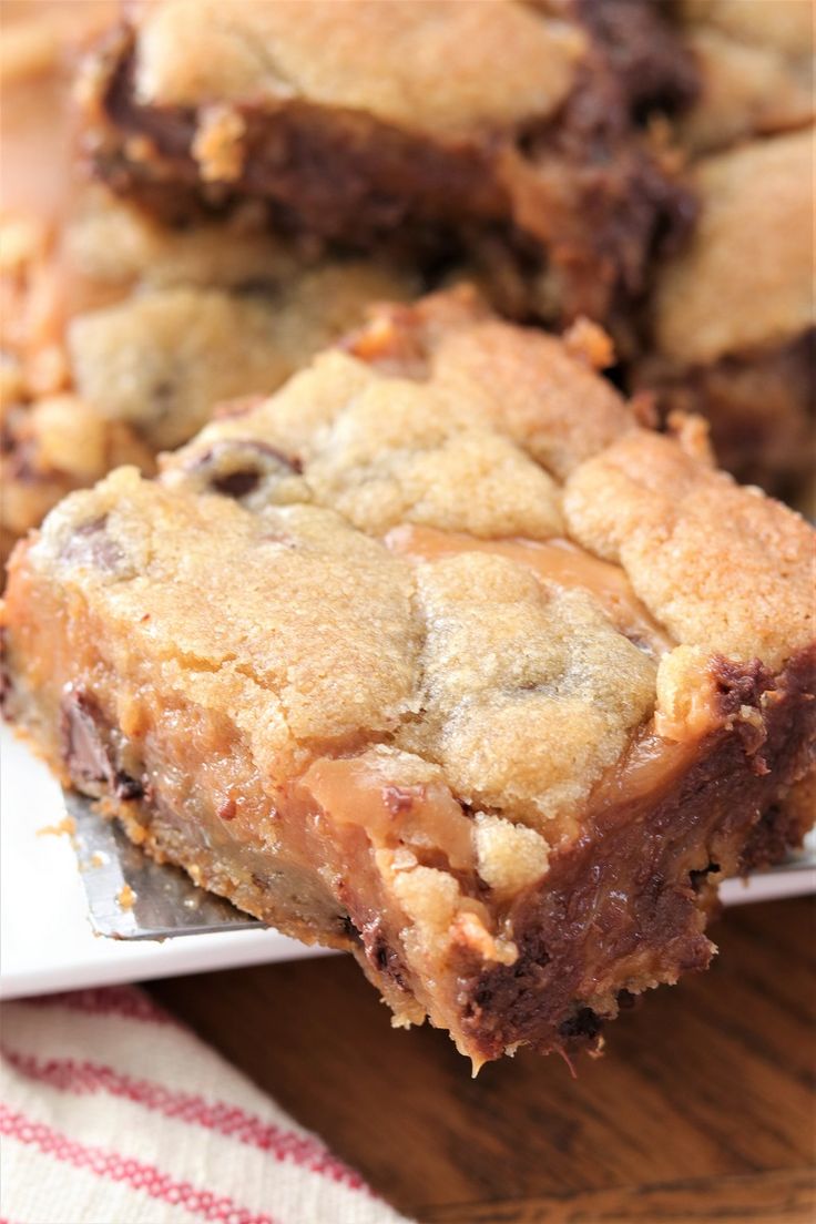 chocolate chip cookie bars are stacked on top of each other, ready to be eaten