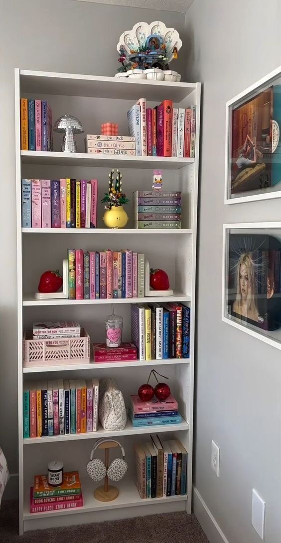 a white book shelf filled with lots of books