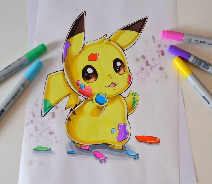 a drawing of a pikachu with crayons and markers on the table