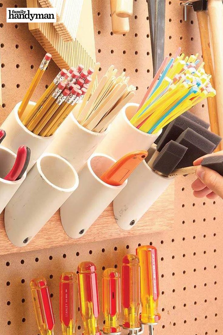 there are many different types of pencils in the holder on this pegboard,