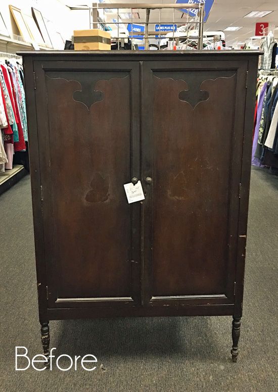 an antique armoire is on display in a store