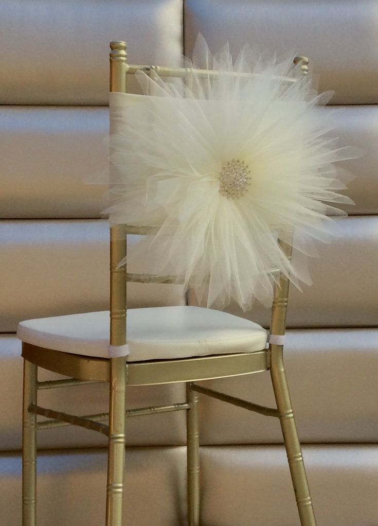 a chair with a white flower on it