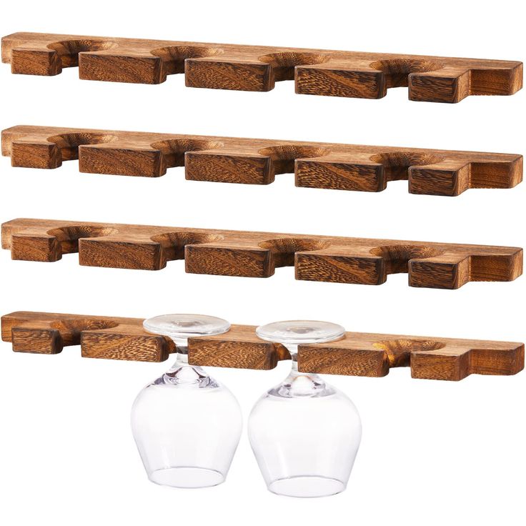 three wine glasses are hanging on the wall with wooden shelves in front of each other