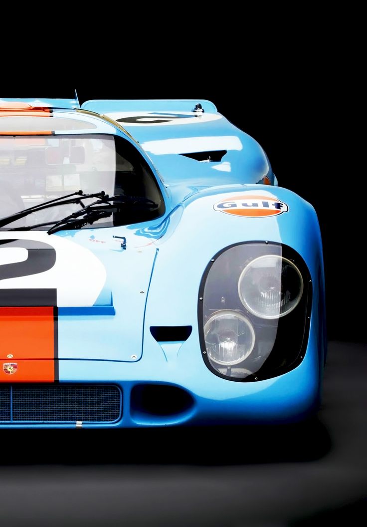 a blue race car with an orange stripe on the front