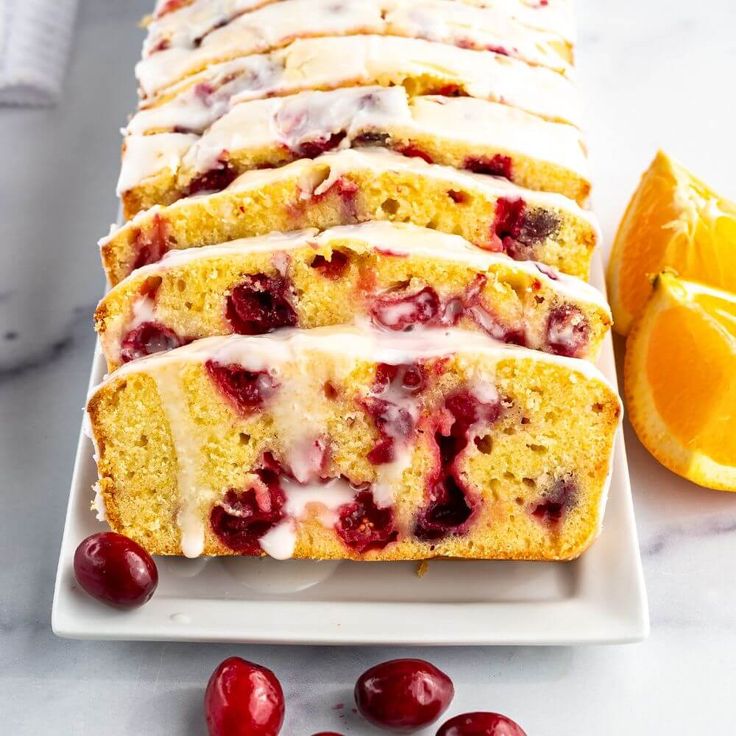 slices of orange cranberry bread on a white plate