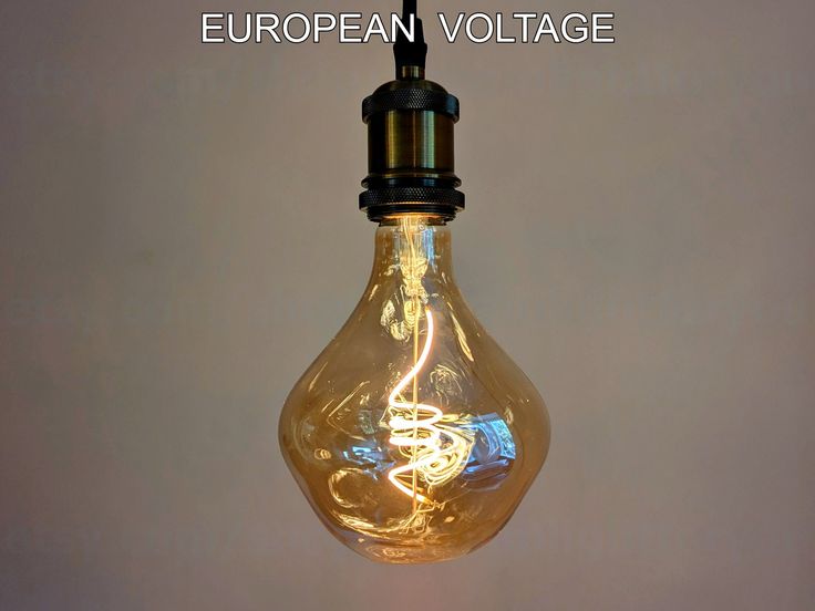 an electric light bulb with the words european voltage on it's side and underneath