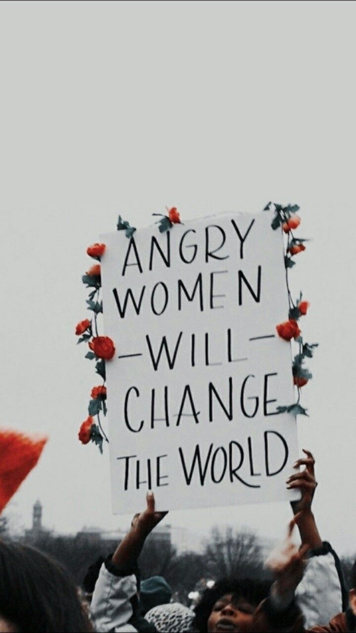 people holding up signs that say angry women will change the world